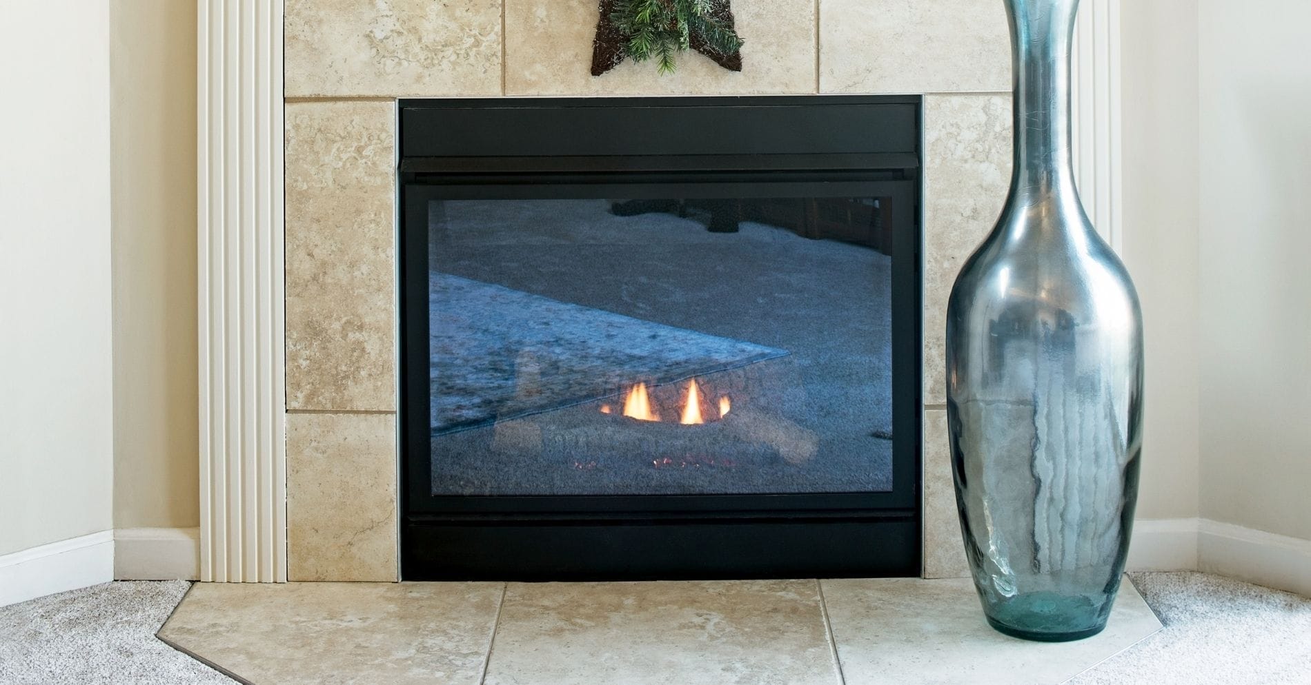 A vase and indoor fireplace